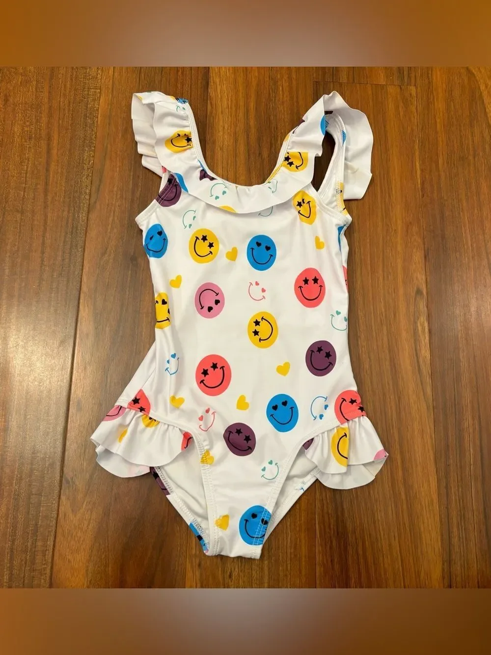 Lola + The Boys white smiley face one piece ruffle bathing suit